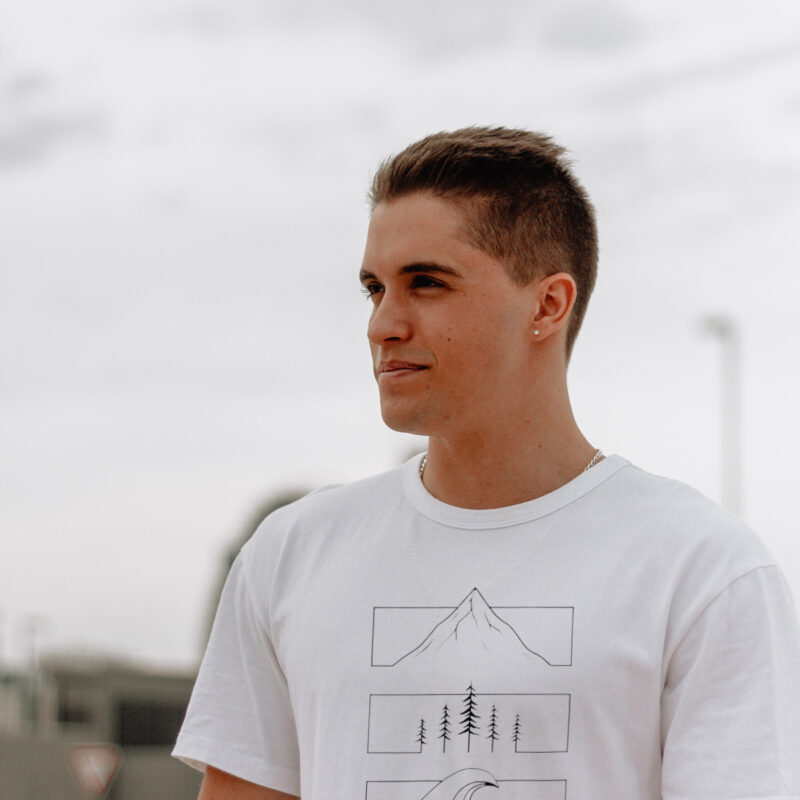 Minimalist Mountain Line Art T-Shirt with a simple mountain design printed on the front.