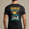 Hawaii Surfing Paradise T-Shirt with a retro-style beach and surf design printed on the back.